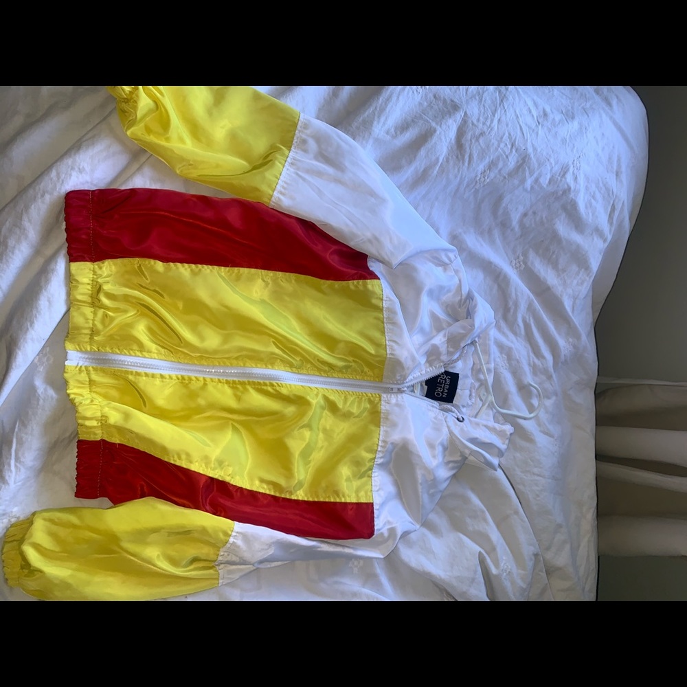 White, red, and yellow windbreaker zip up